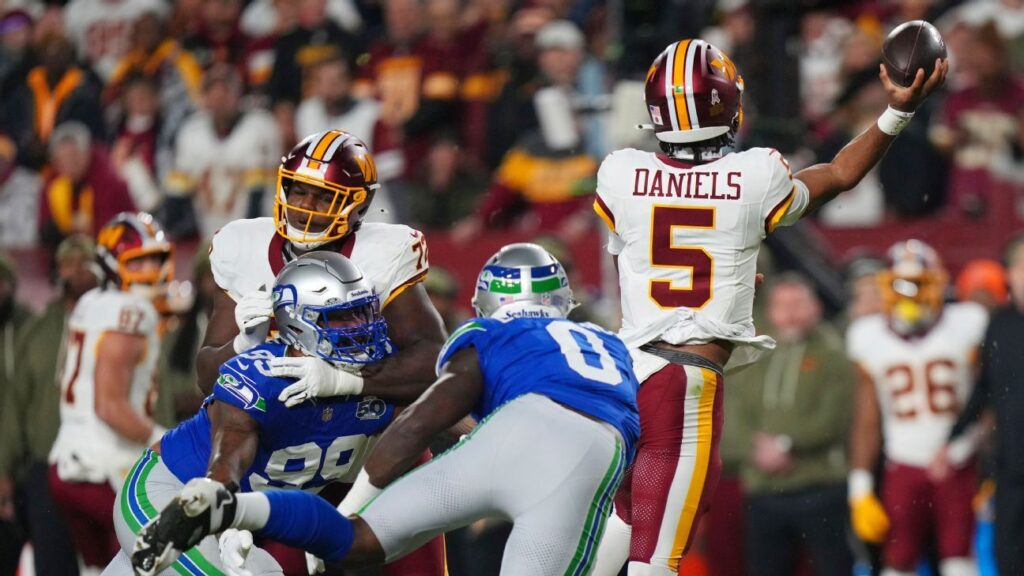 Commanders QB Daniels suffers serious-looking left arm injury