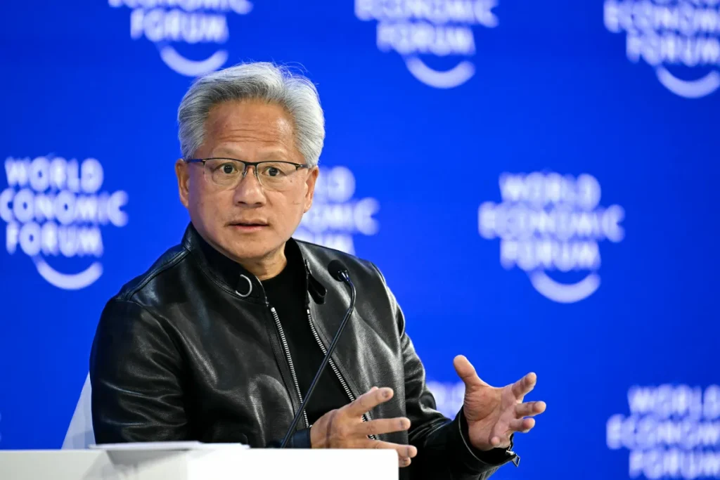 Nvidia CEO Jensen Huang tells Trump 'we're not going to let [an AI slowdown] happen'